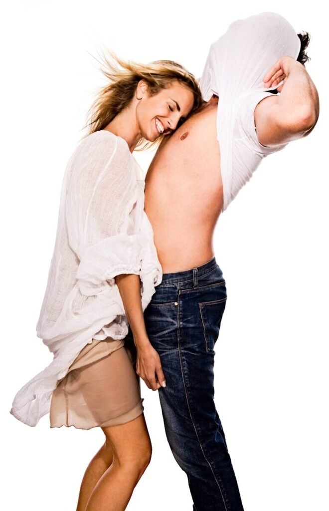 woman standing in front of man