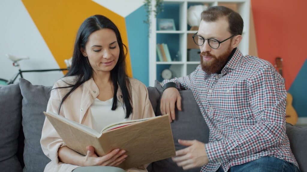 Couple looking at an open photo album together