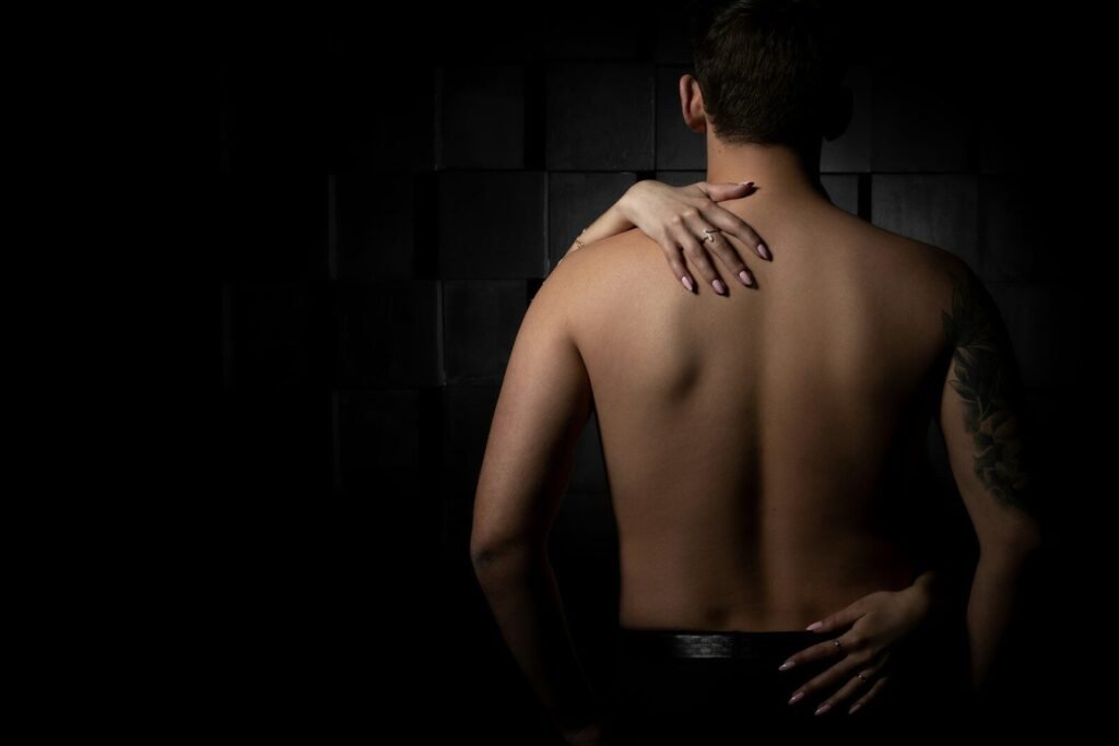 topless man in black pants