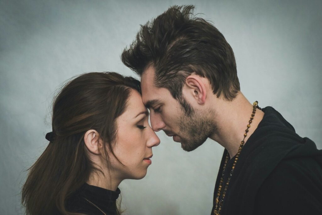 man and woman kissing each other
