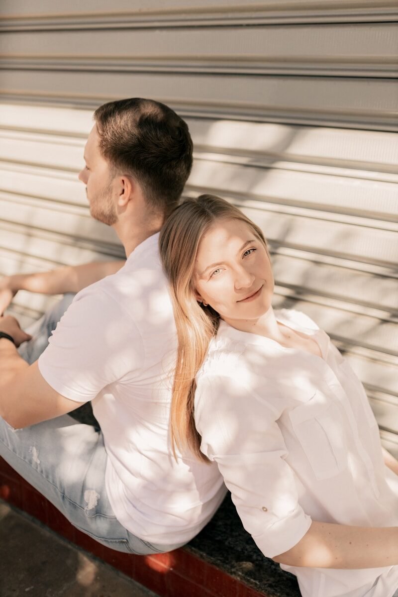 A man and a woman sitting on a bench
