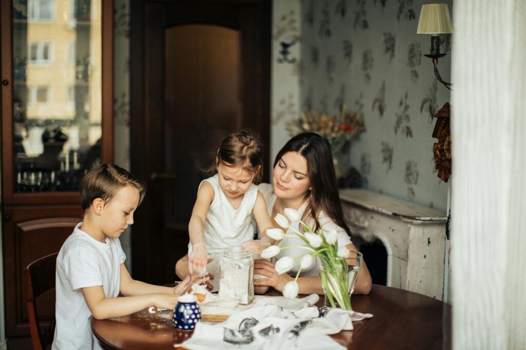 Mother and children baking together in a cozy home setting.