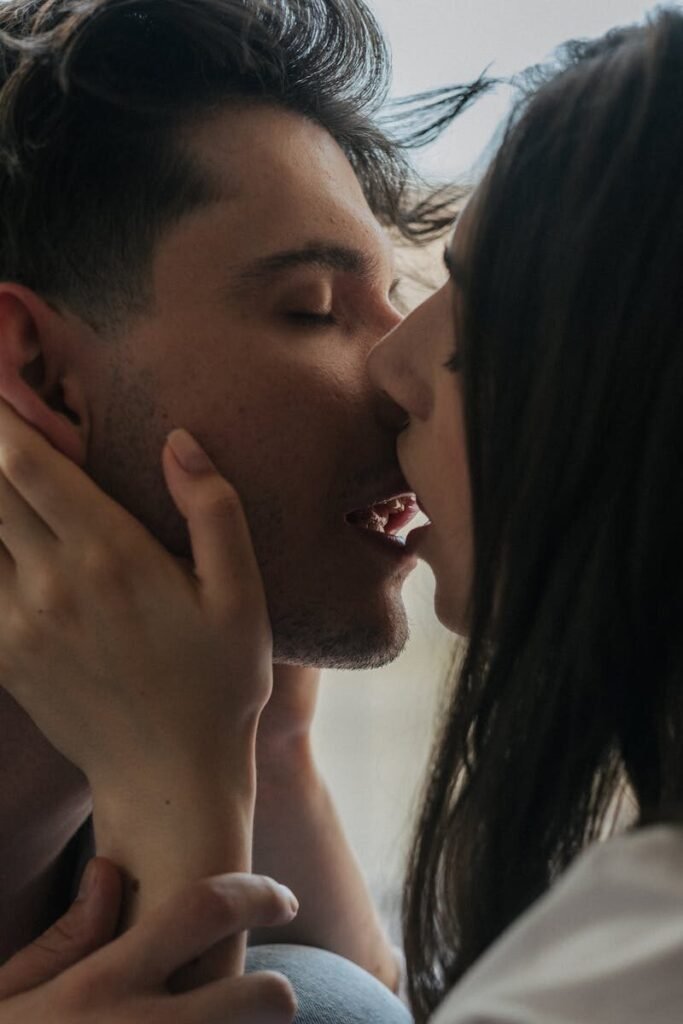 A close-up portrait of an intimate moment shared between a couple, exemplifying love.