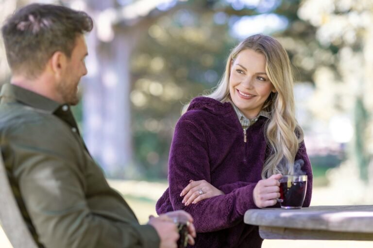 A man and a woman sitting at a table talking