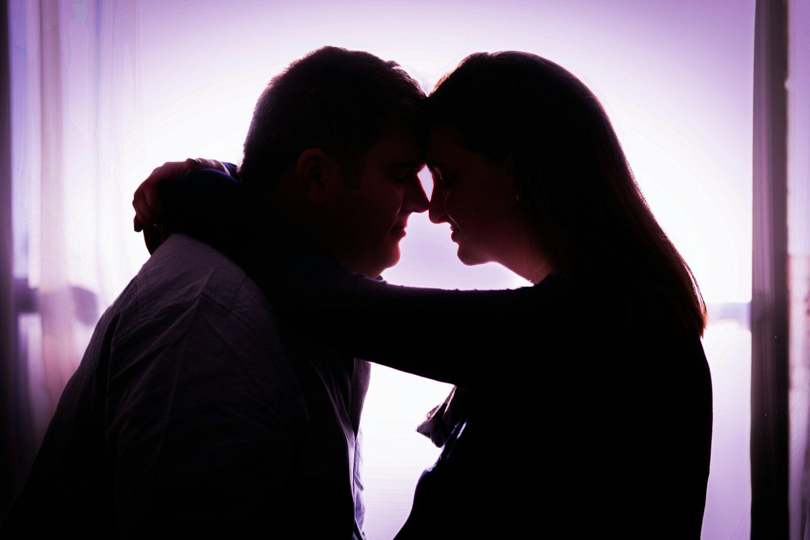 a man and a woman standing next to each other