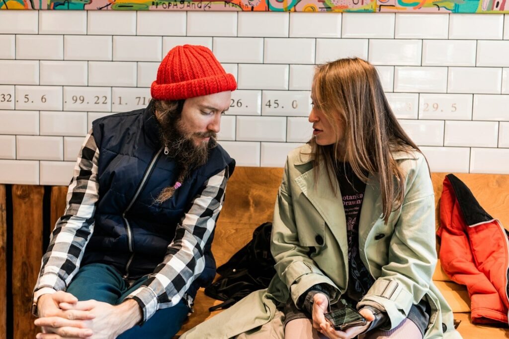 a man and a woman sitting on a bench