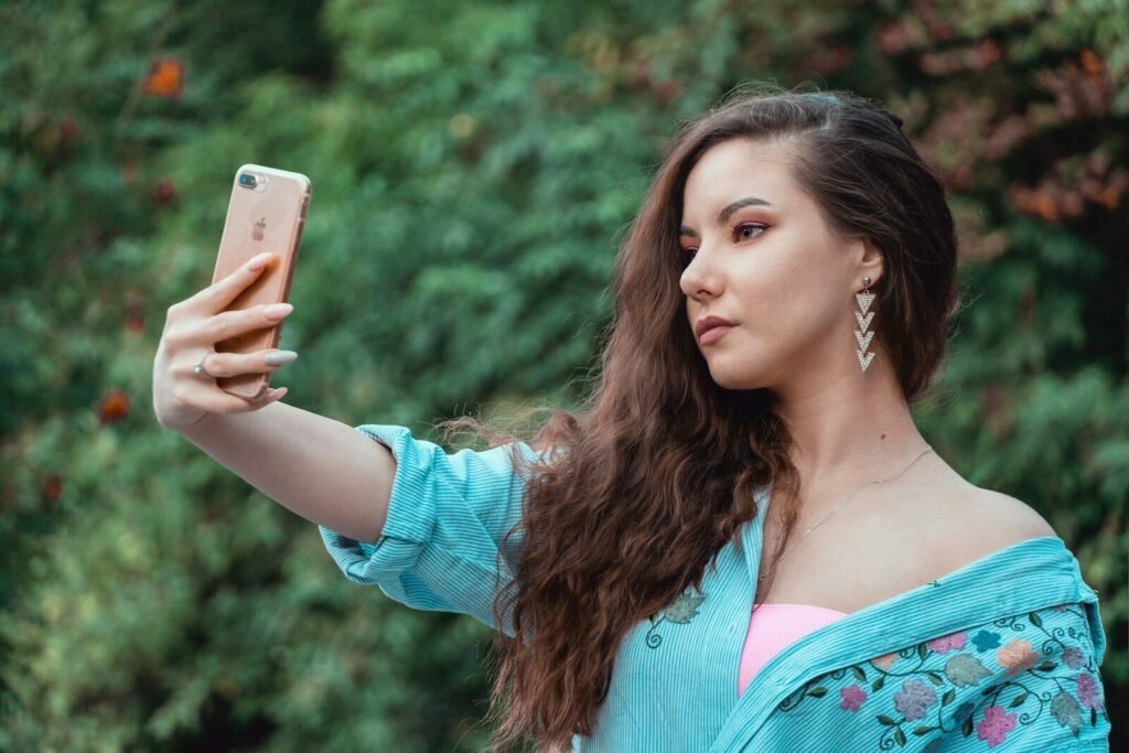 A woman taking a picture with her cell phone